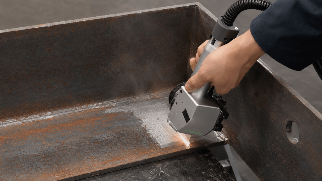 Laser Cleaning for Weld Preparation: Remove Rust, Oxides and Coatings Before Welding | Sichuan Strongest Laser Technology Co., Ltd Handheld laser cleaning head removing rust from a metal joint before welding
